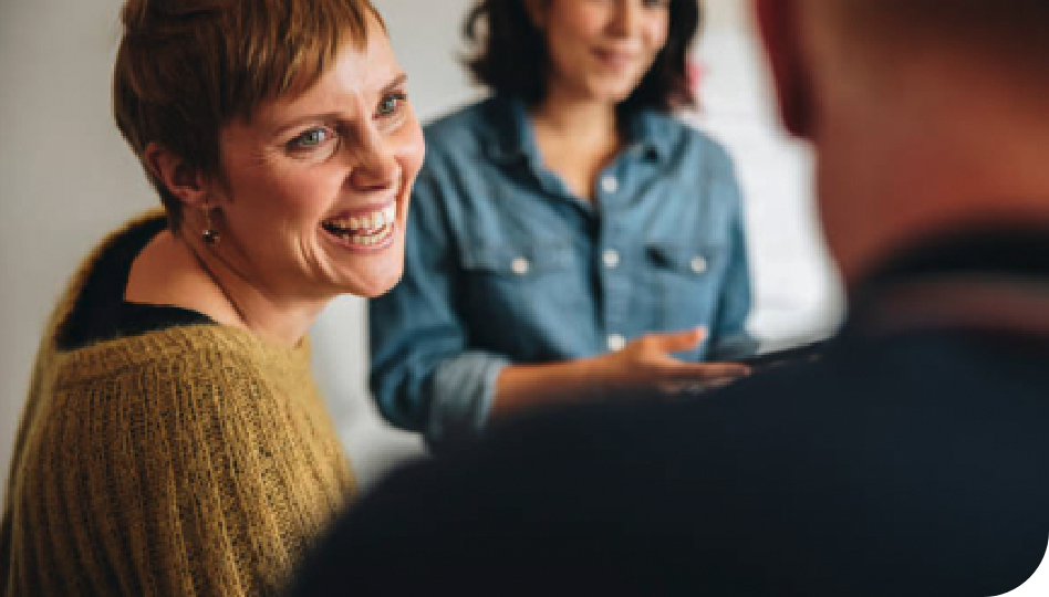 Image of woman smiling in a business setting