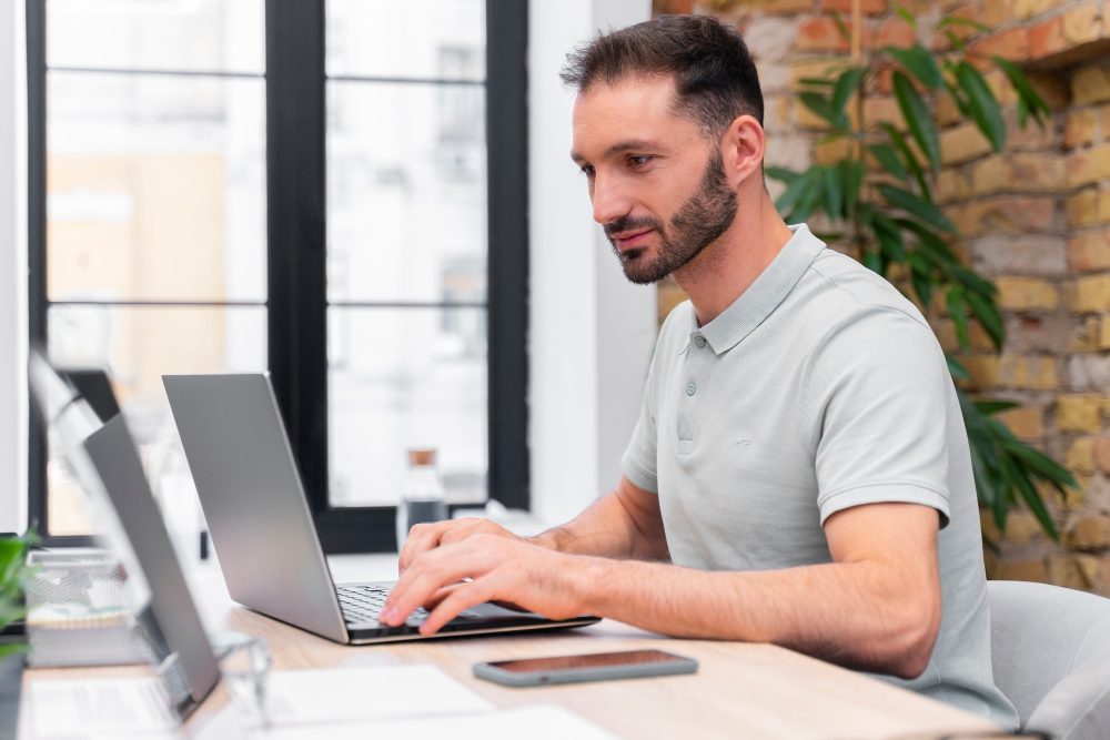 man-working-on-computer-learning-management-system-datafisher